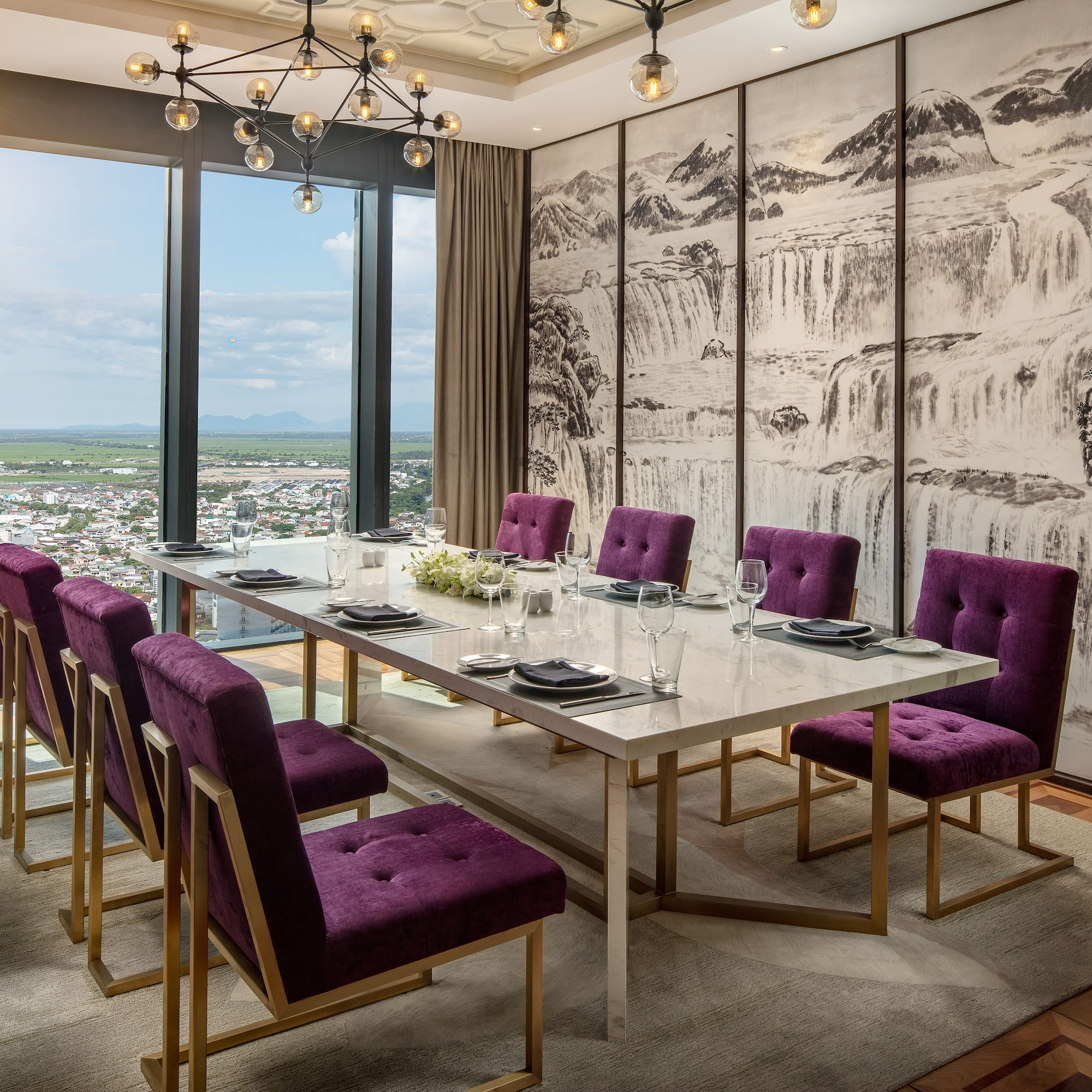 a dining room with purple chairs and a table
