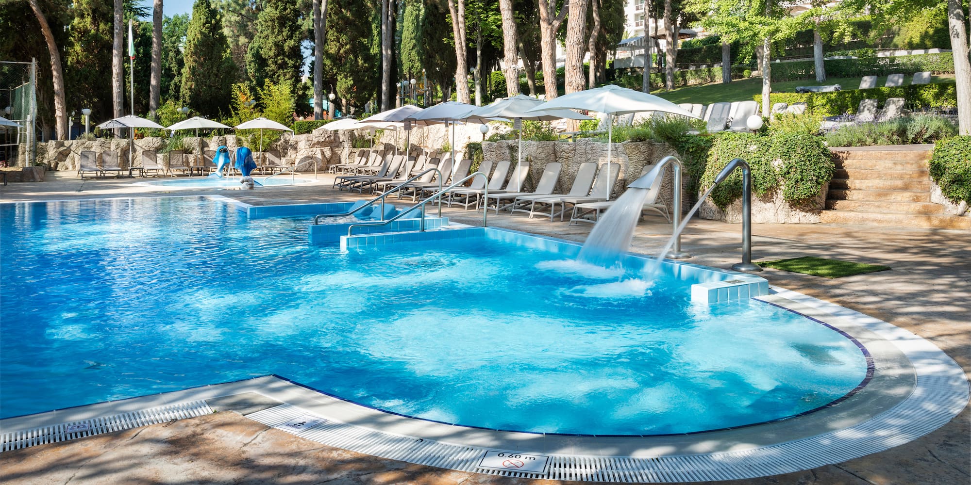 a pool with a waterfall
