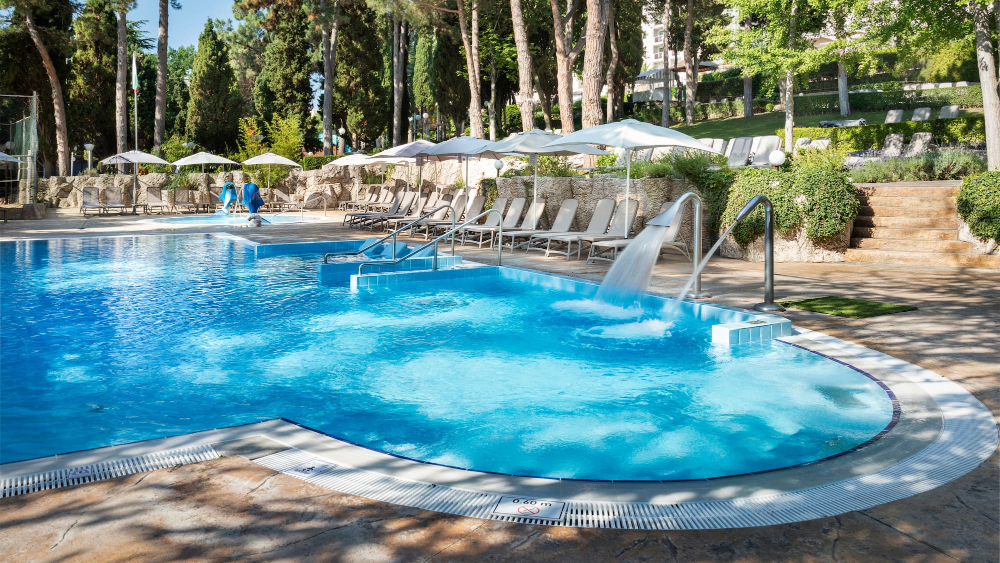 a pool with a waterfall