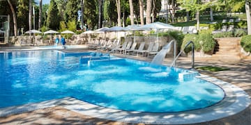 a pool with a waterfall