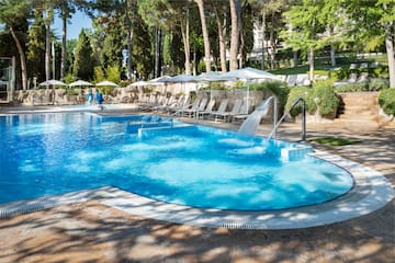 a pool with a waterfall