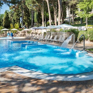 a pool with a waterfall