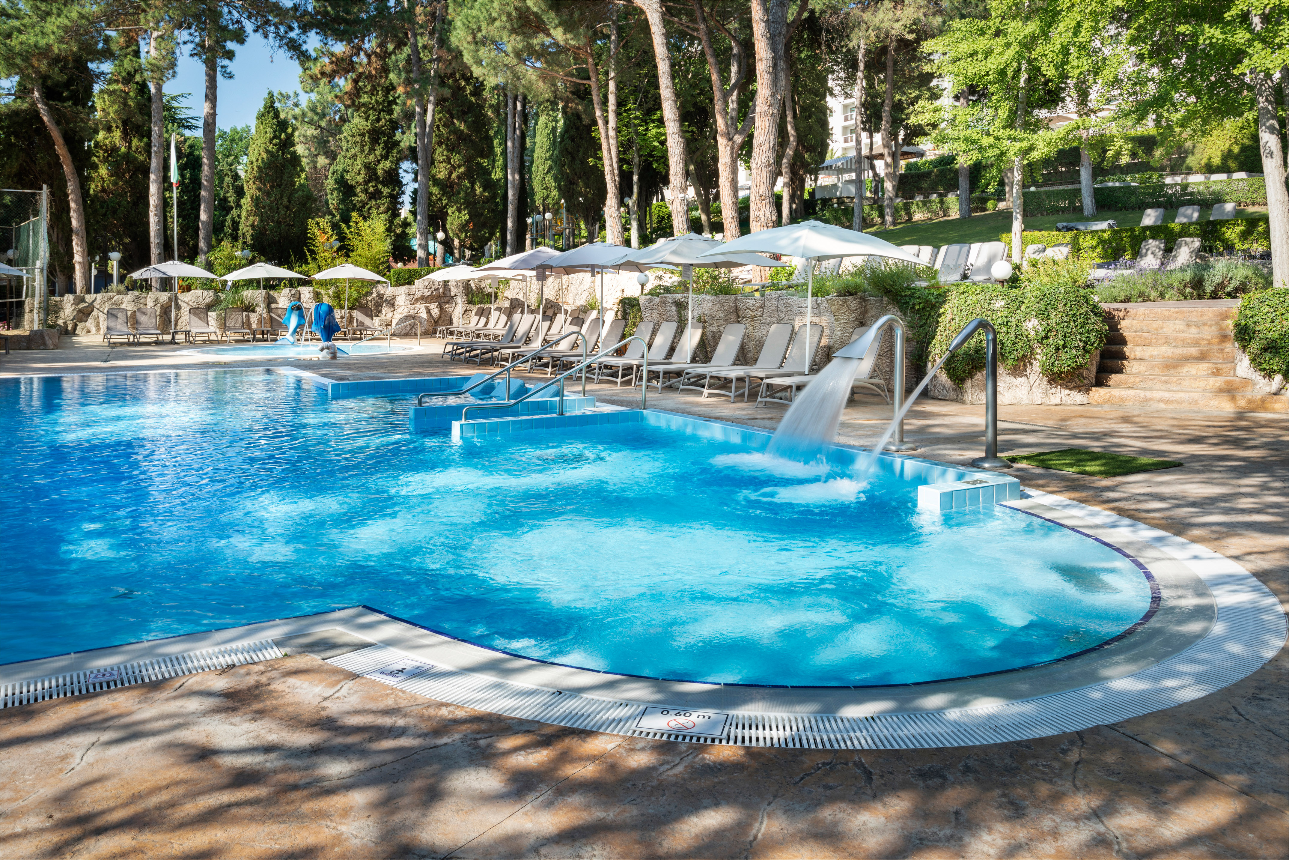 a pool with a waterfall