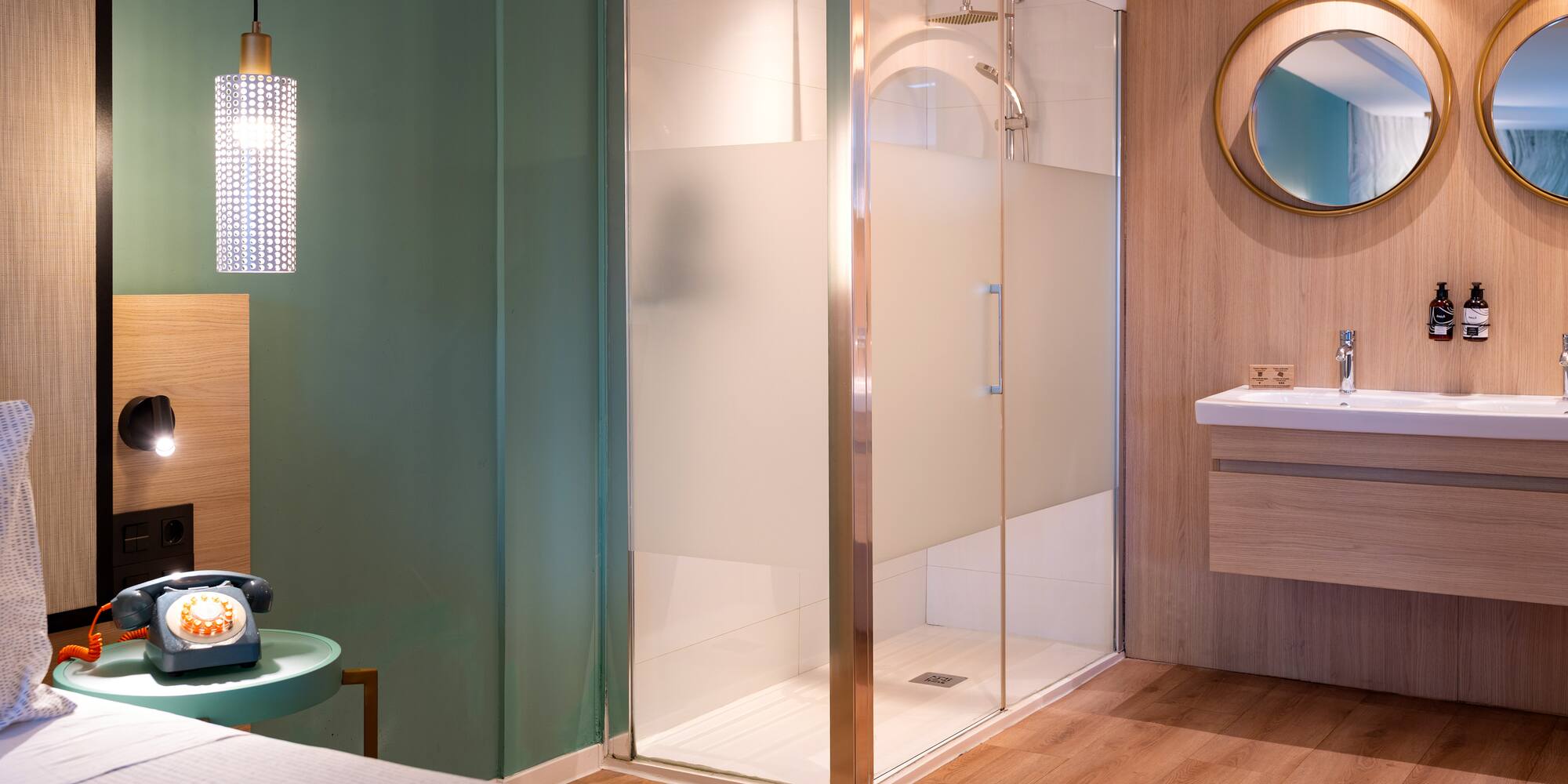 a bathroom with a glass shower and sink