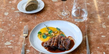 a plate of food and a glass of wine