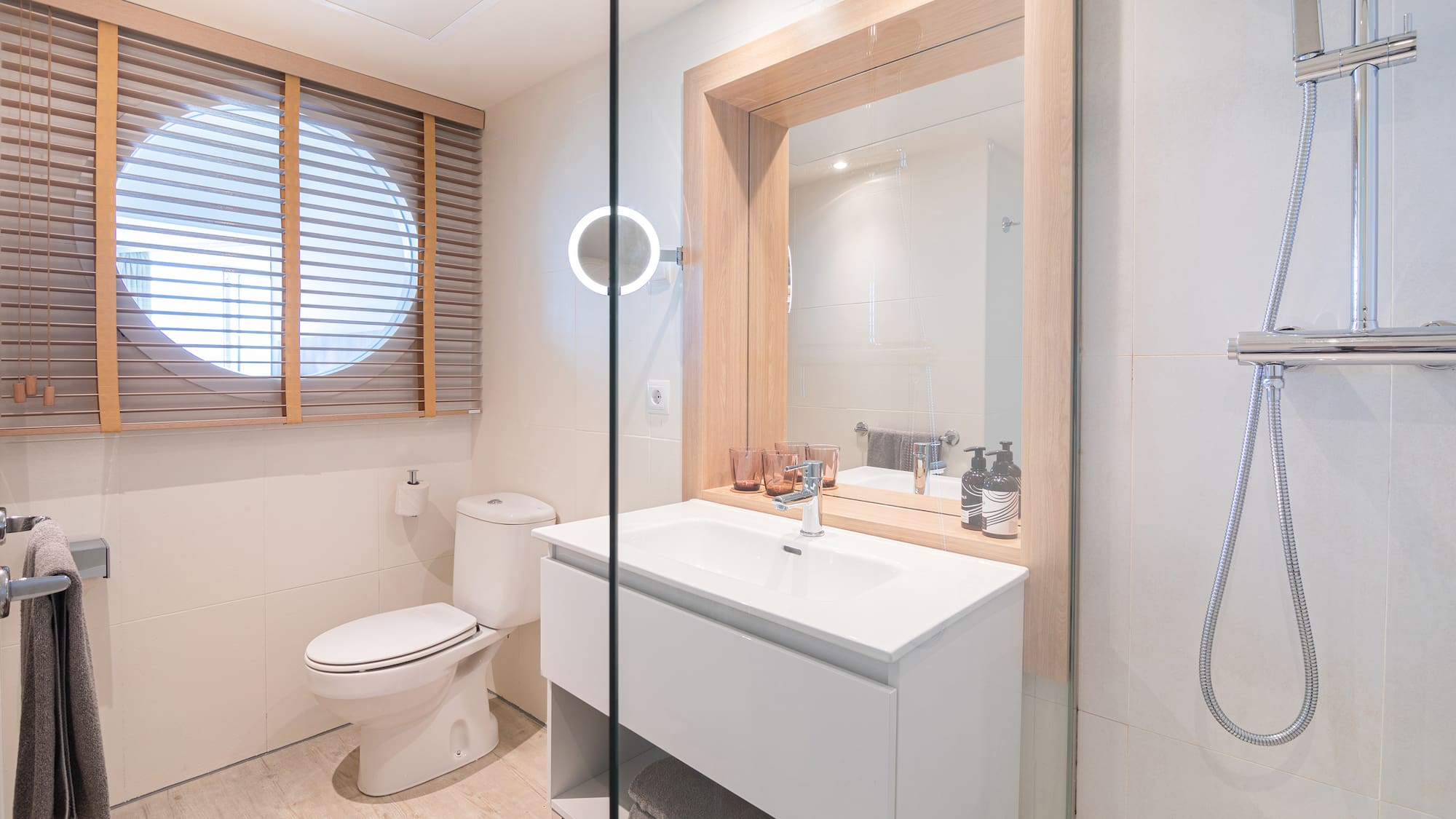a bathroom with a sink toilet and mirror.