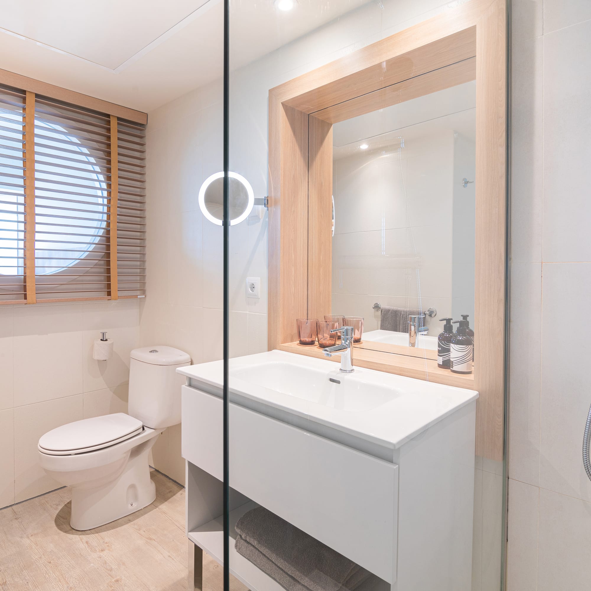 a bathroom with a sink toilet and mirror.