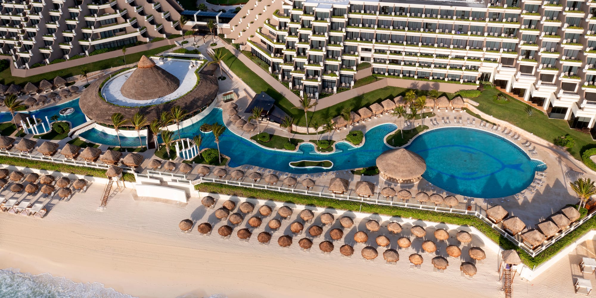 a resort with a pool and a beach