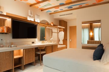 a room with a bed and a mirror