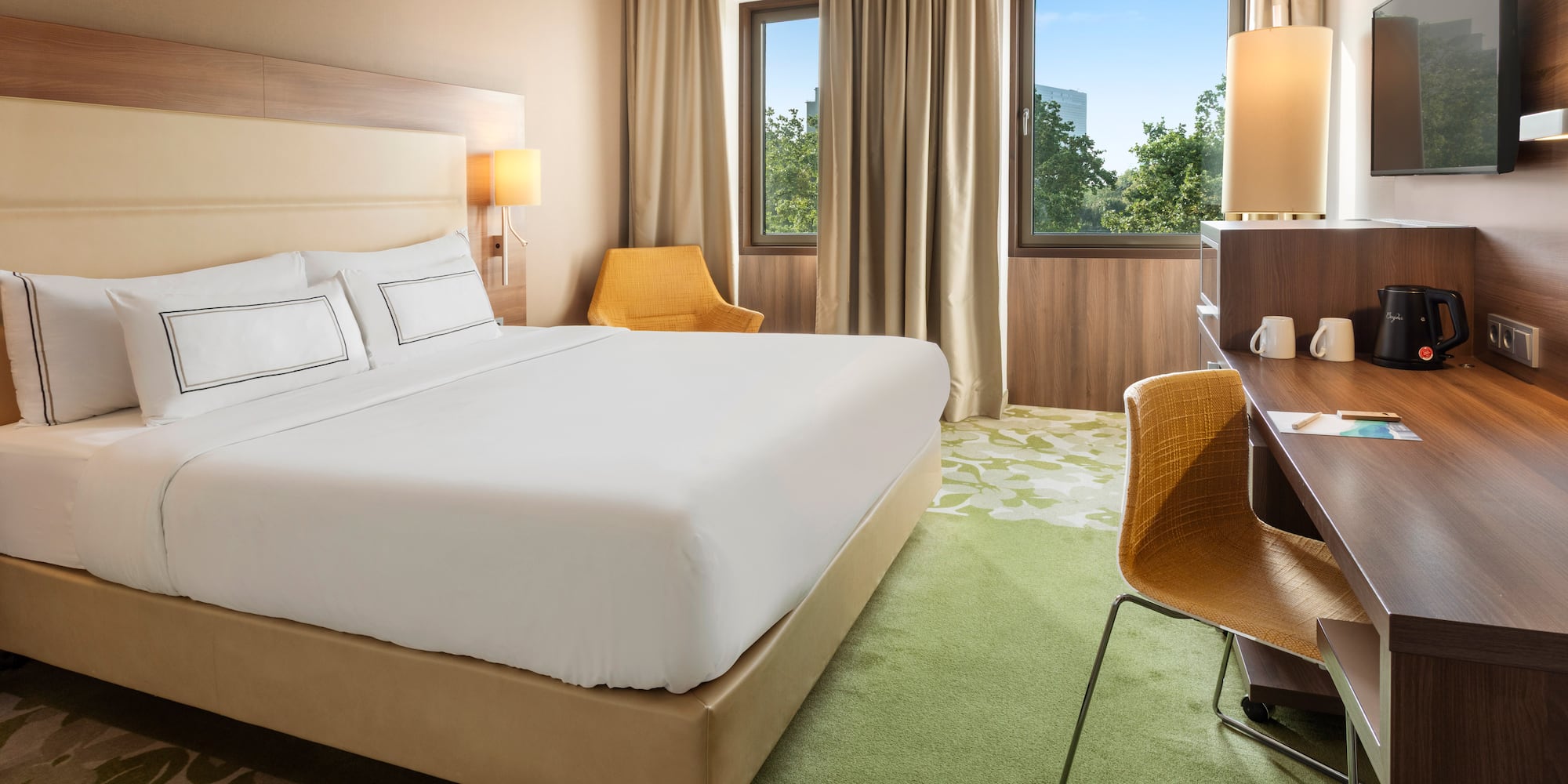 a room with a bed and desk