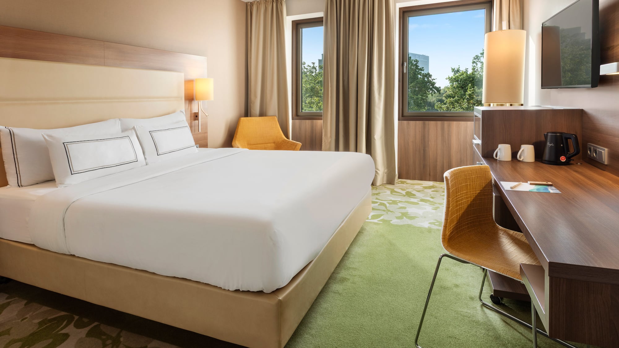 a room with a bed and desk