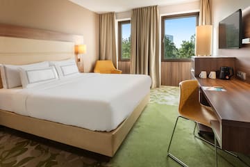 a room with a bed and desk