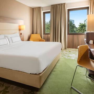 a room with a bed and desk