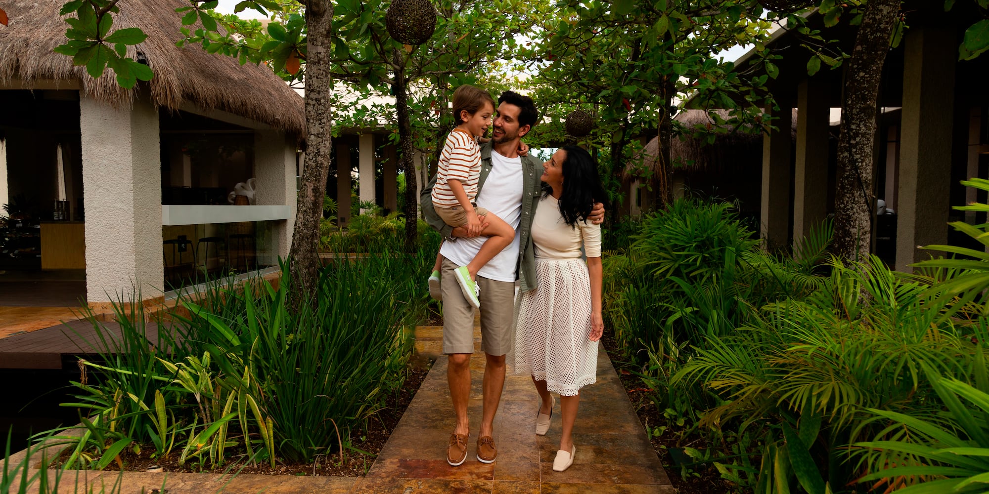 a man holding a child in his arms