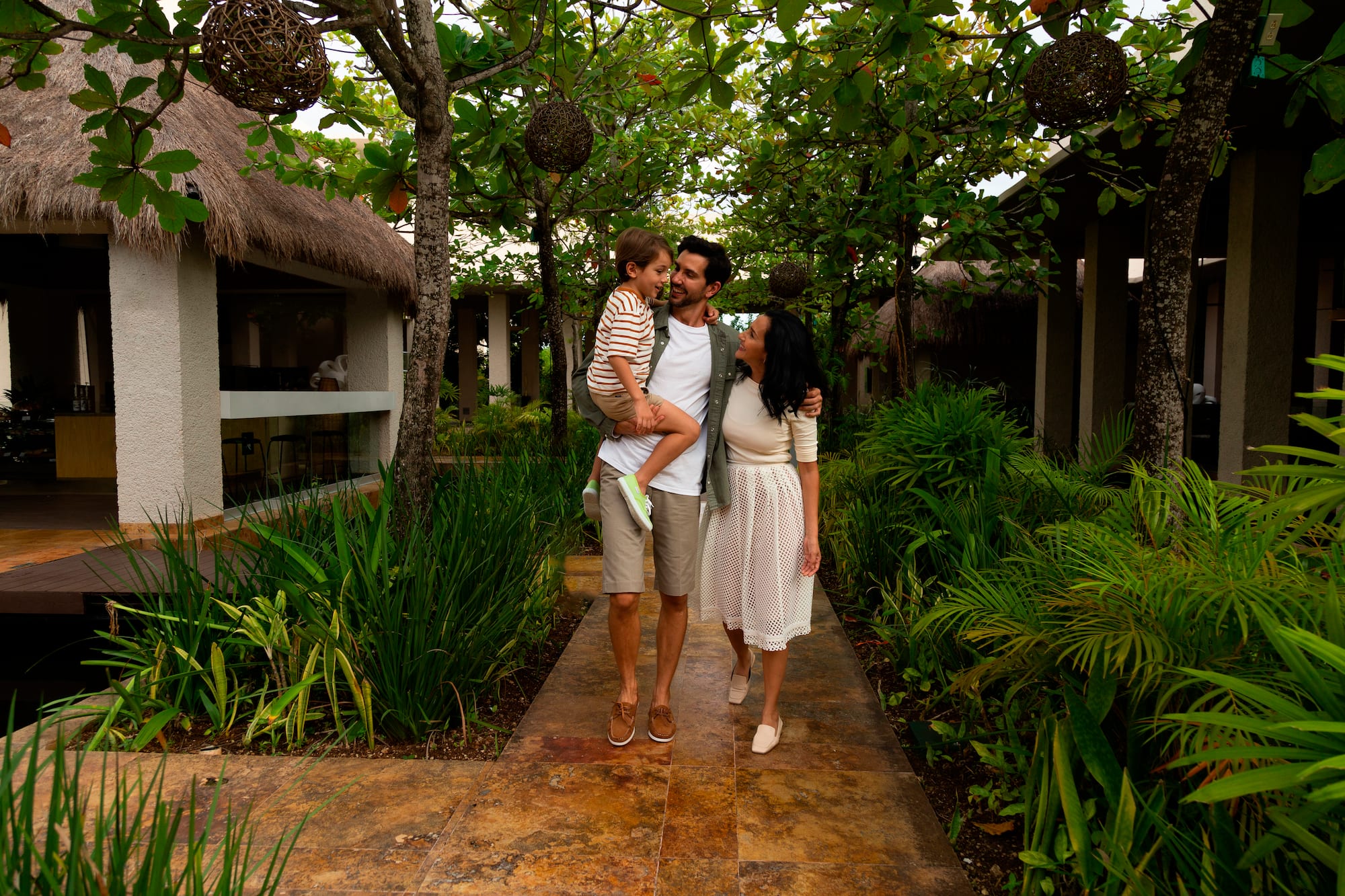 a man holding a child in his arms