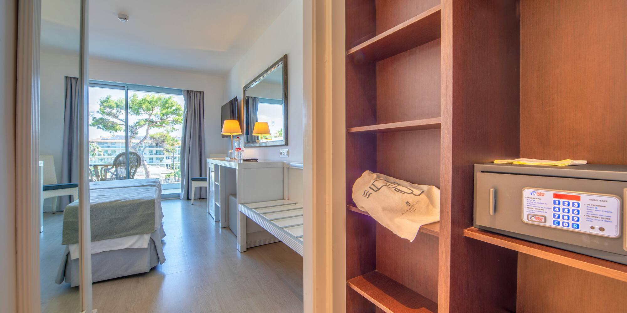 a room with a bed and a bookcase