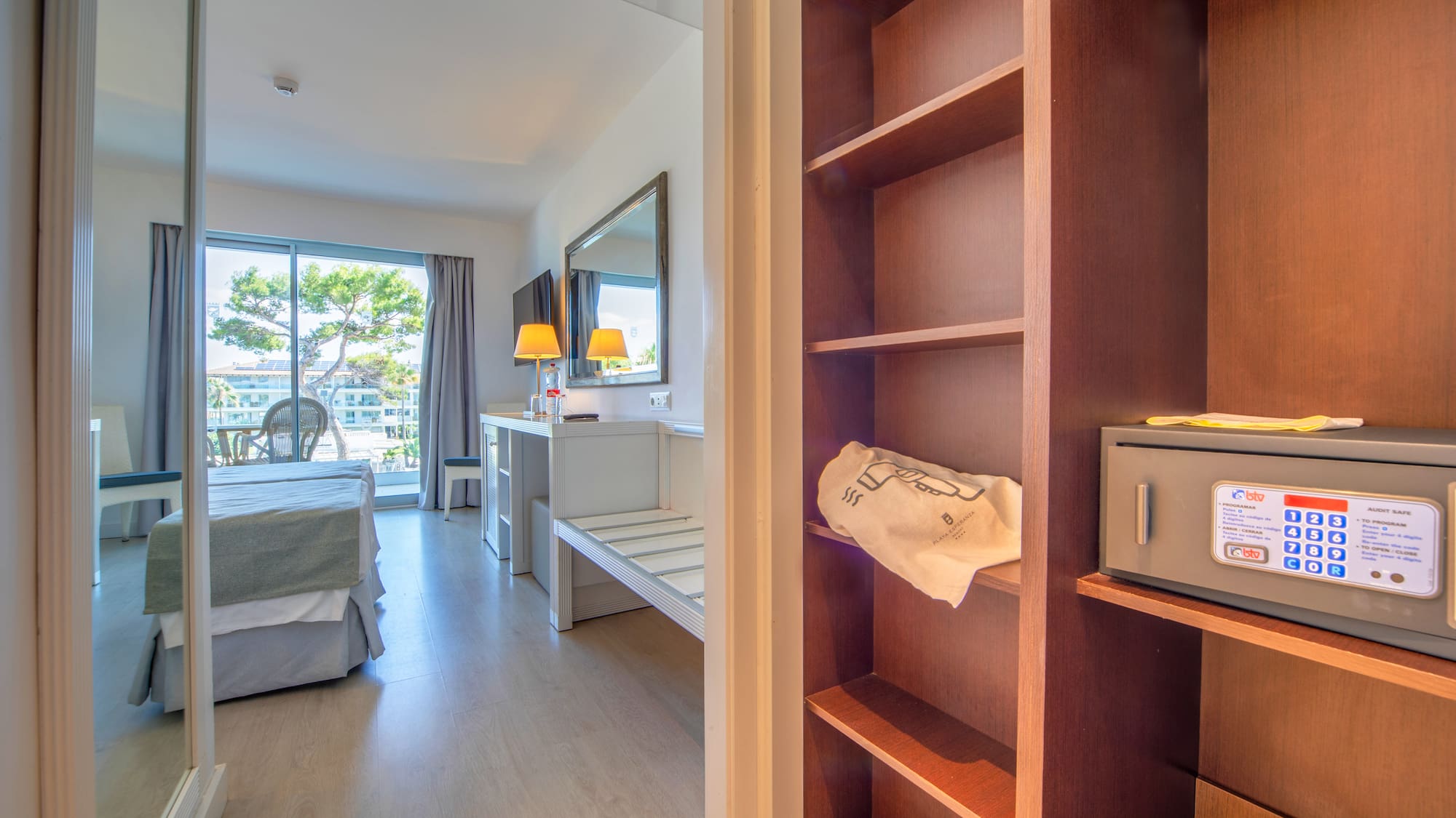 a room with a bed and a bookcase