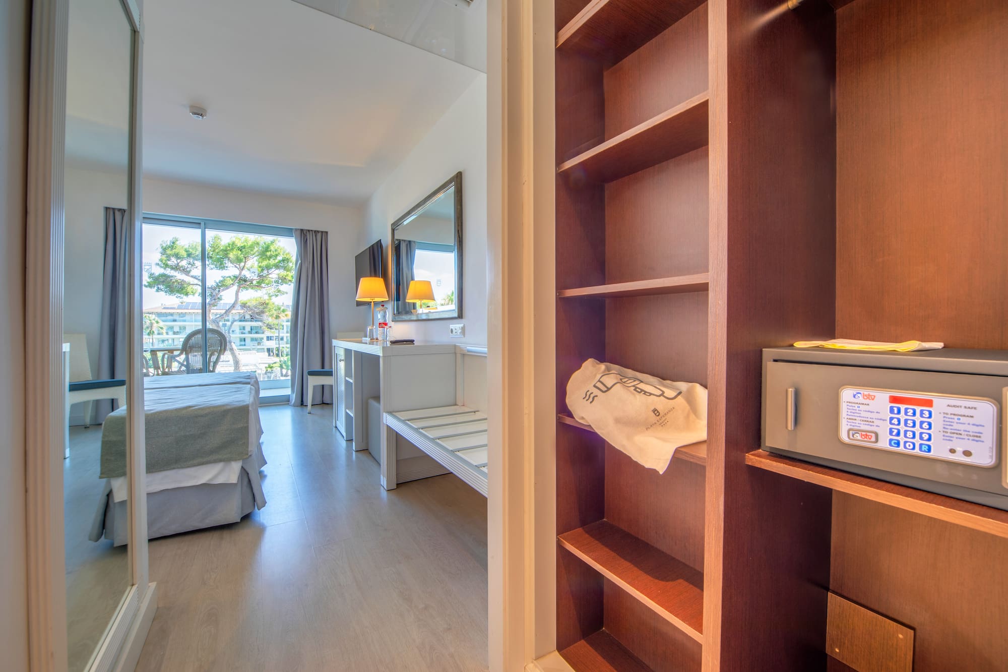 a room with a bed and a bookcase