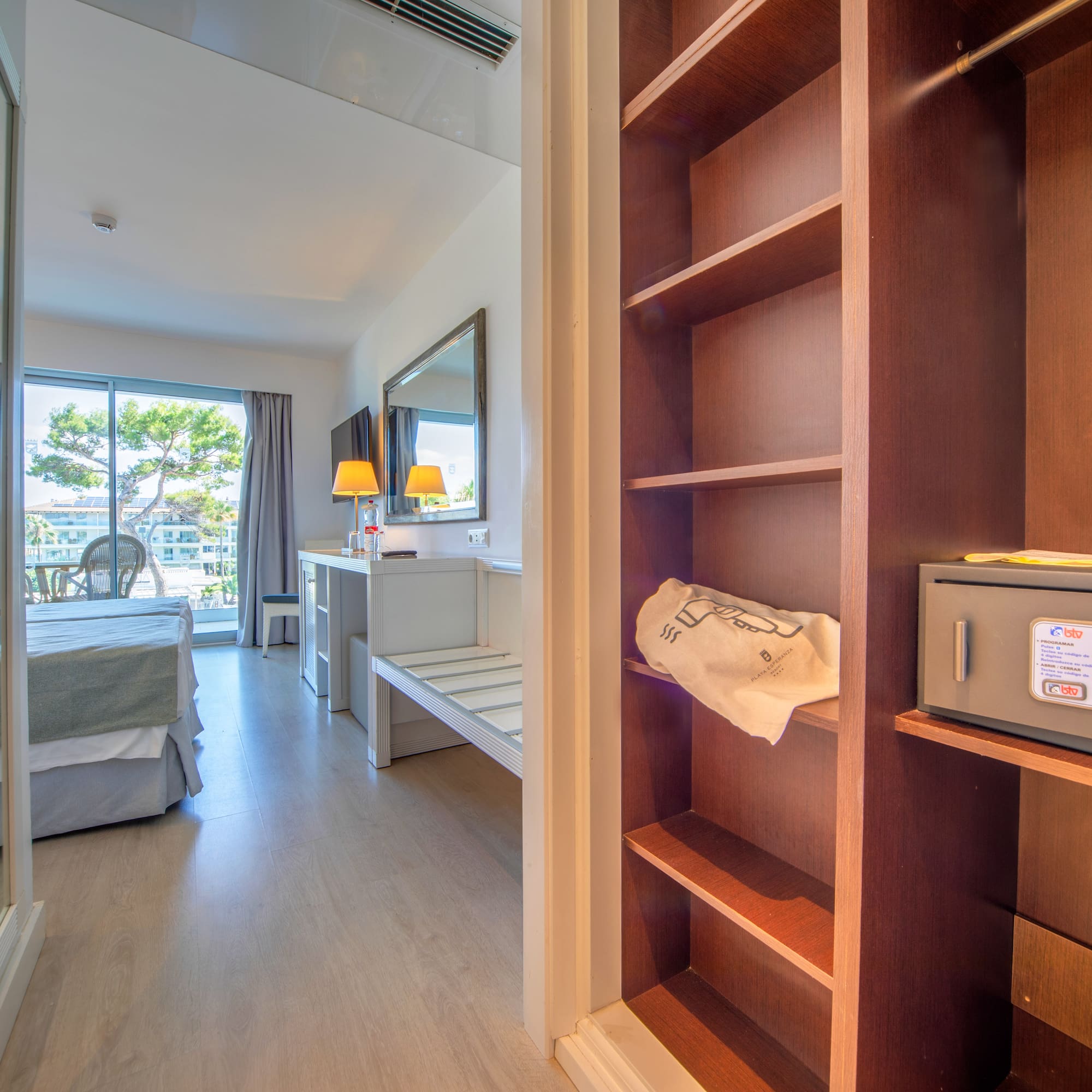 a room with a bed and a bookcase