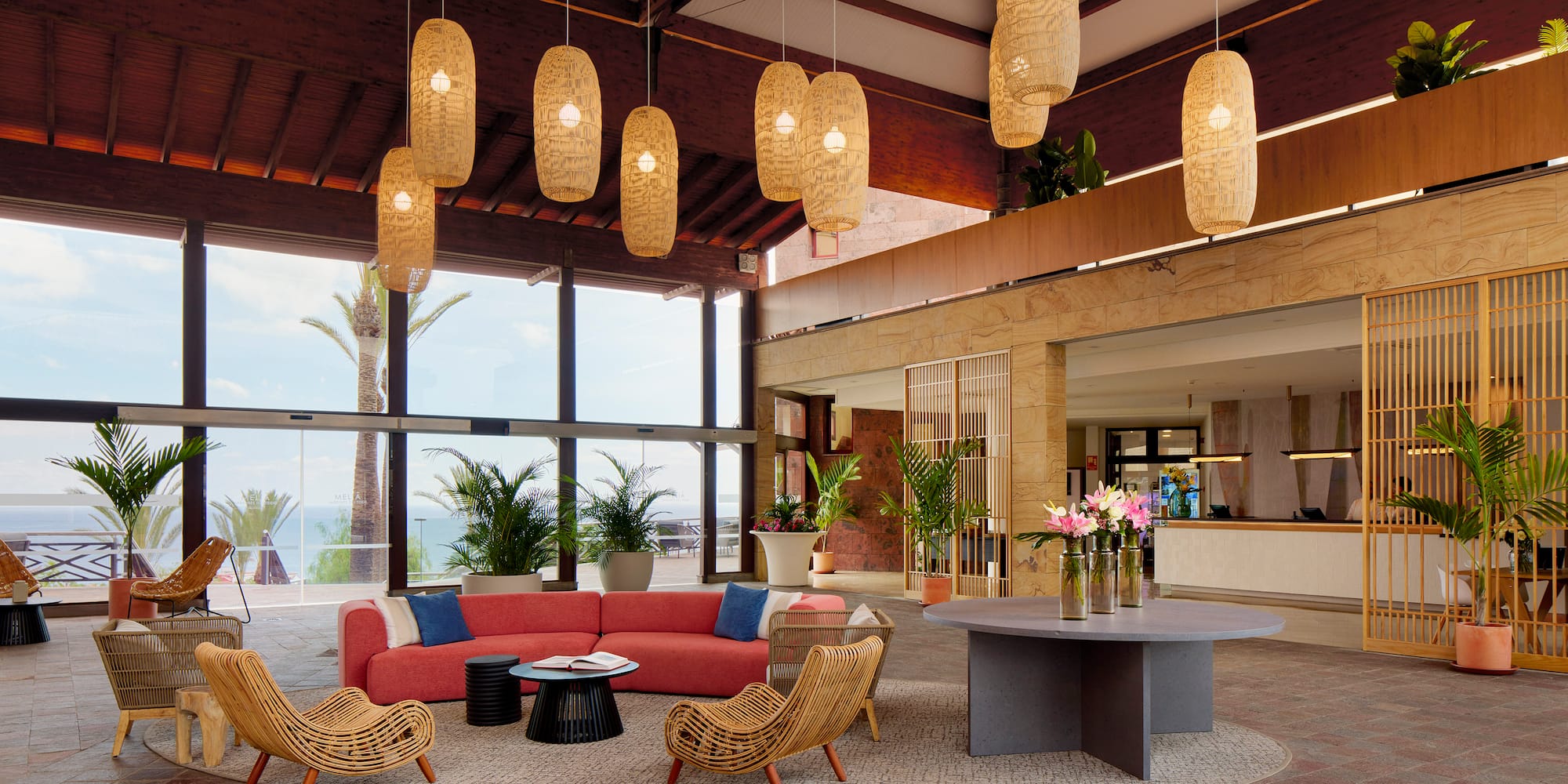 a room with a couch and chairs