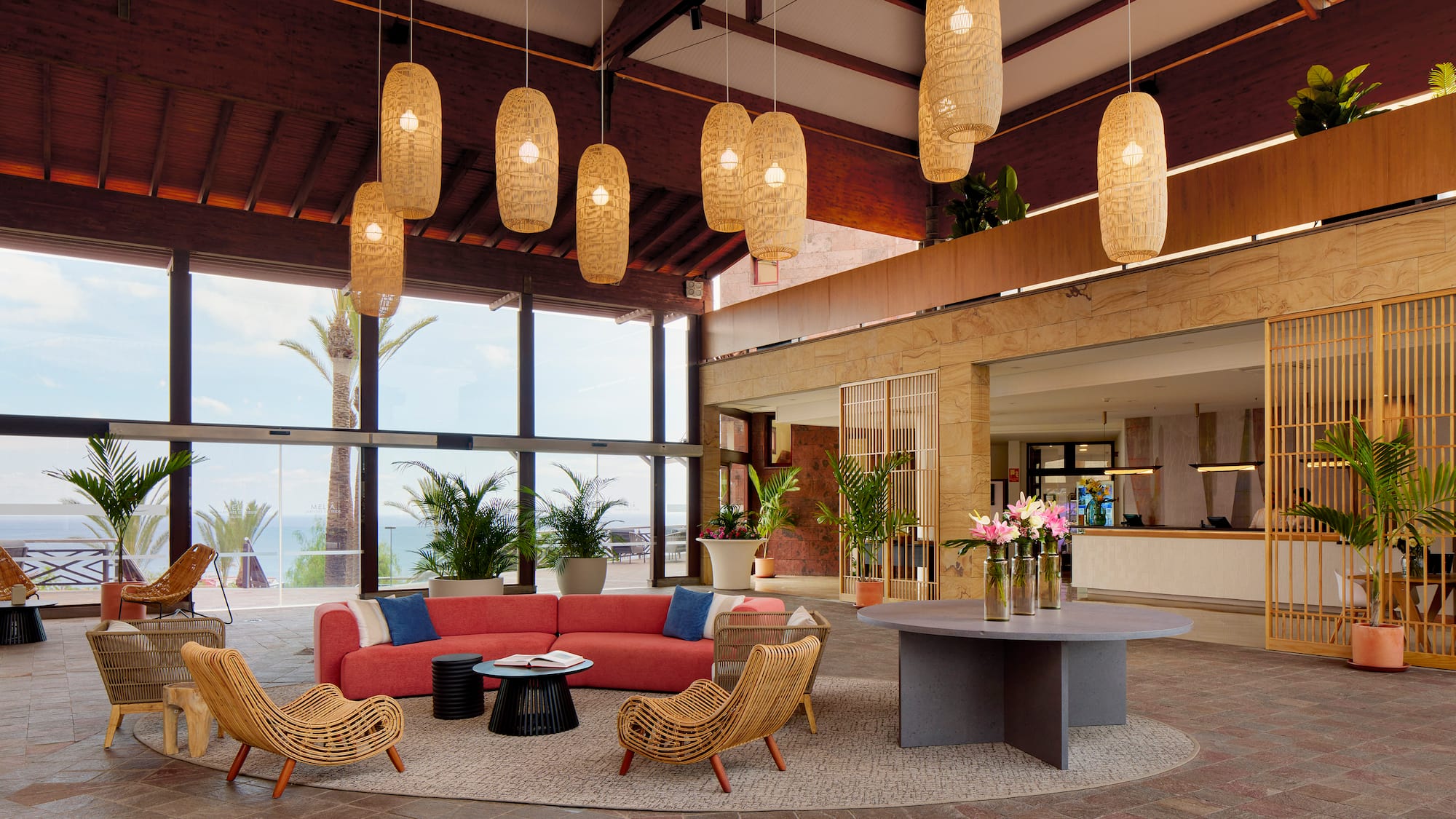 a room with a couch and chairs