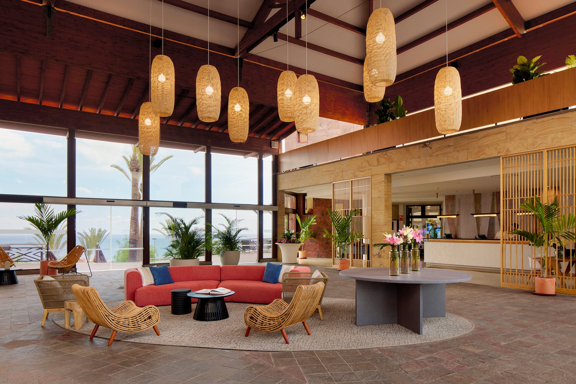 a room with a couch and chairs