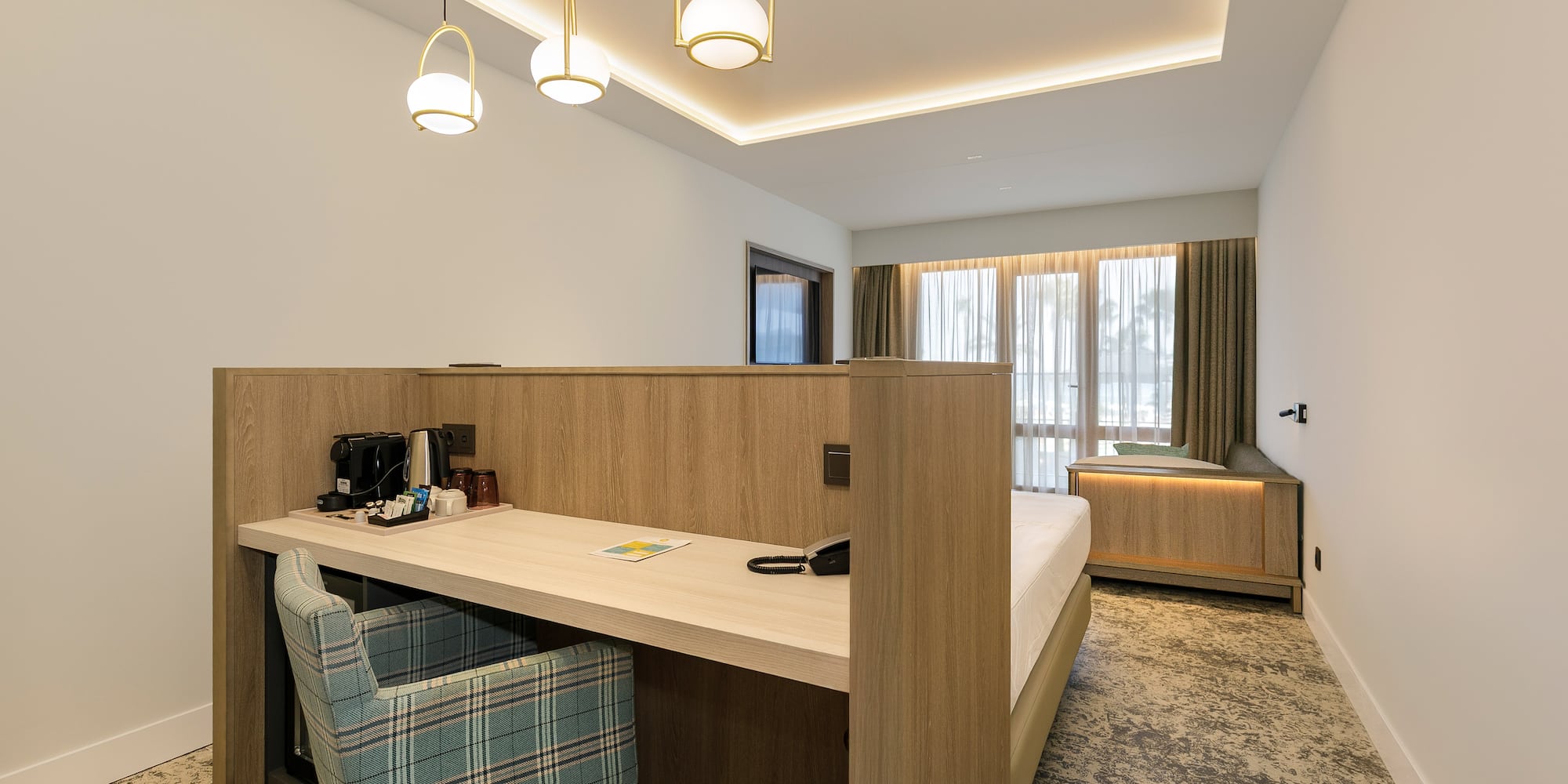 a room with a bed and a desk