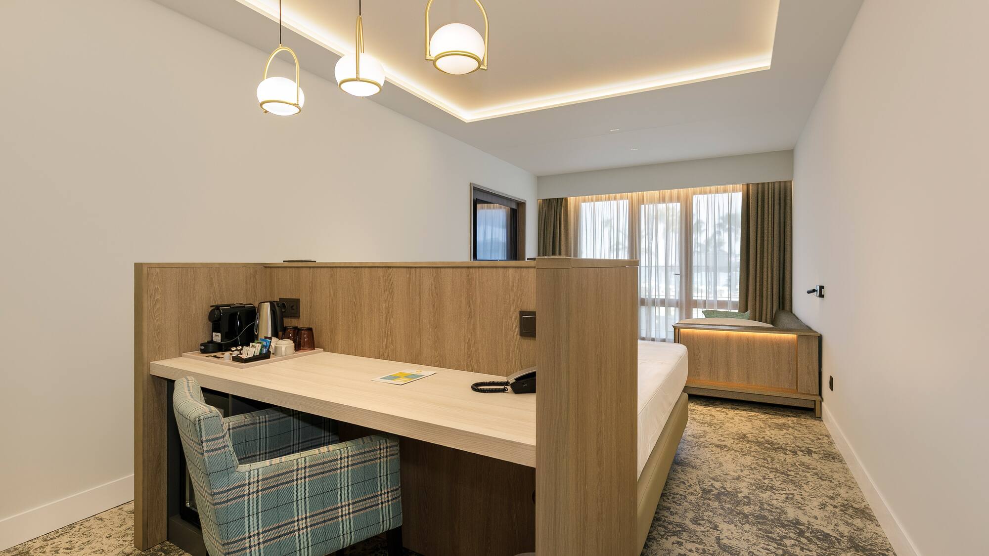 a room with a bed and a desk