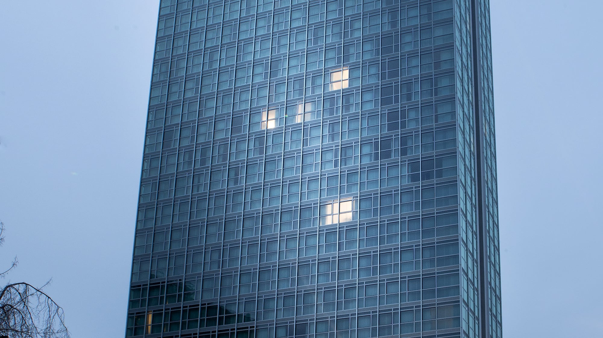 a tall glass building with windows