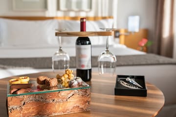a wine bottle and wine glasses on a table