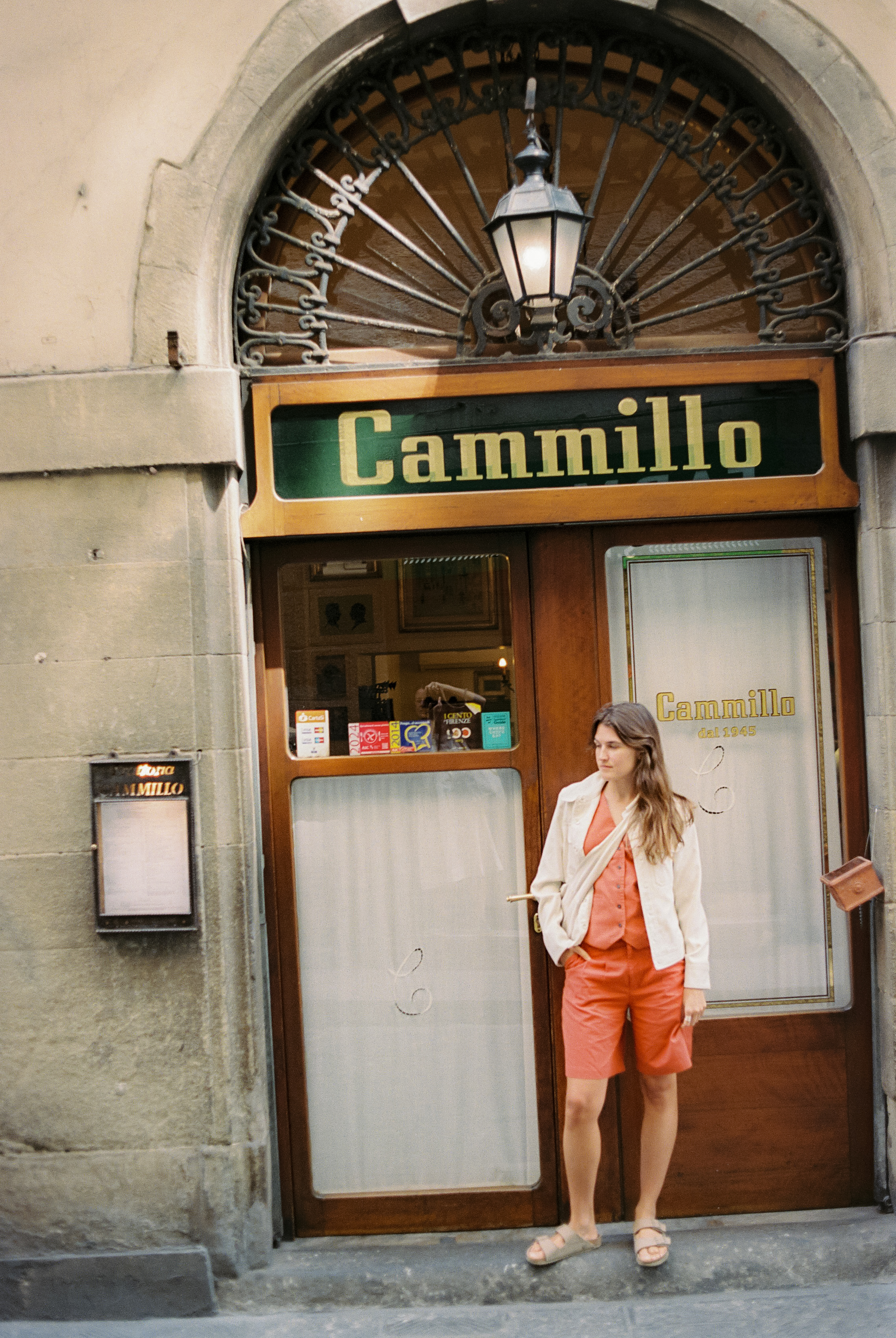 a woman standing in front of a store