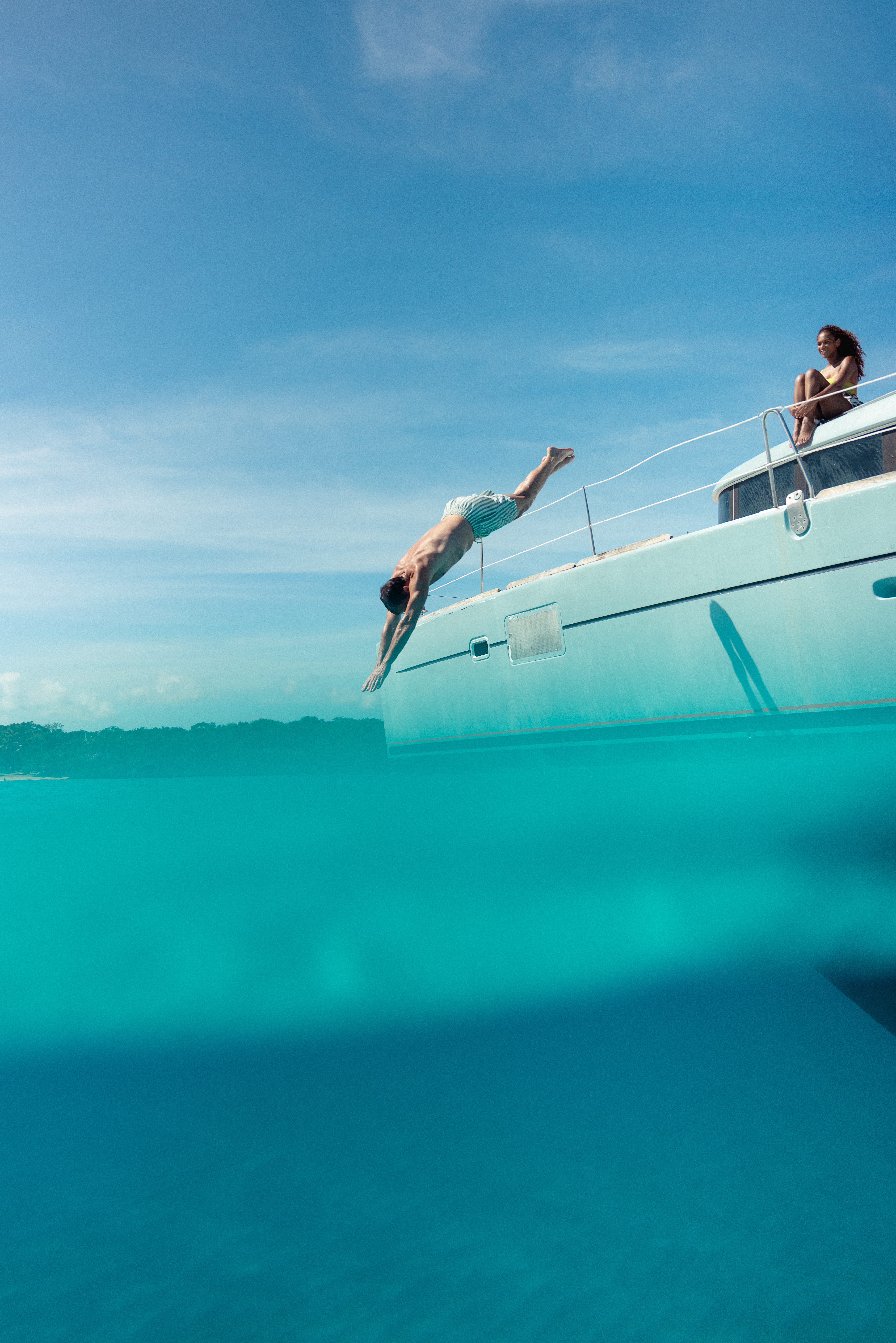 a man diving into a boat