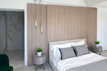 a bedroom with a bed and a plant