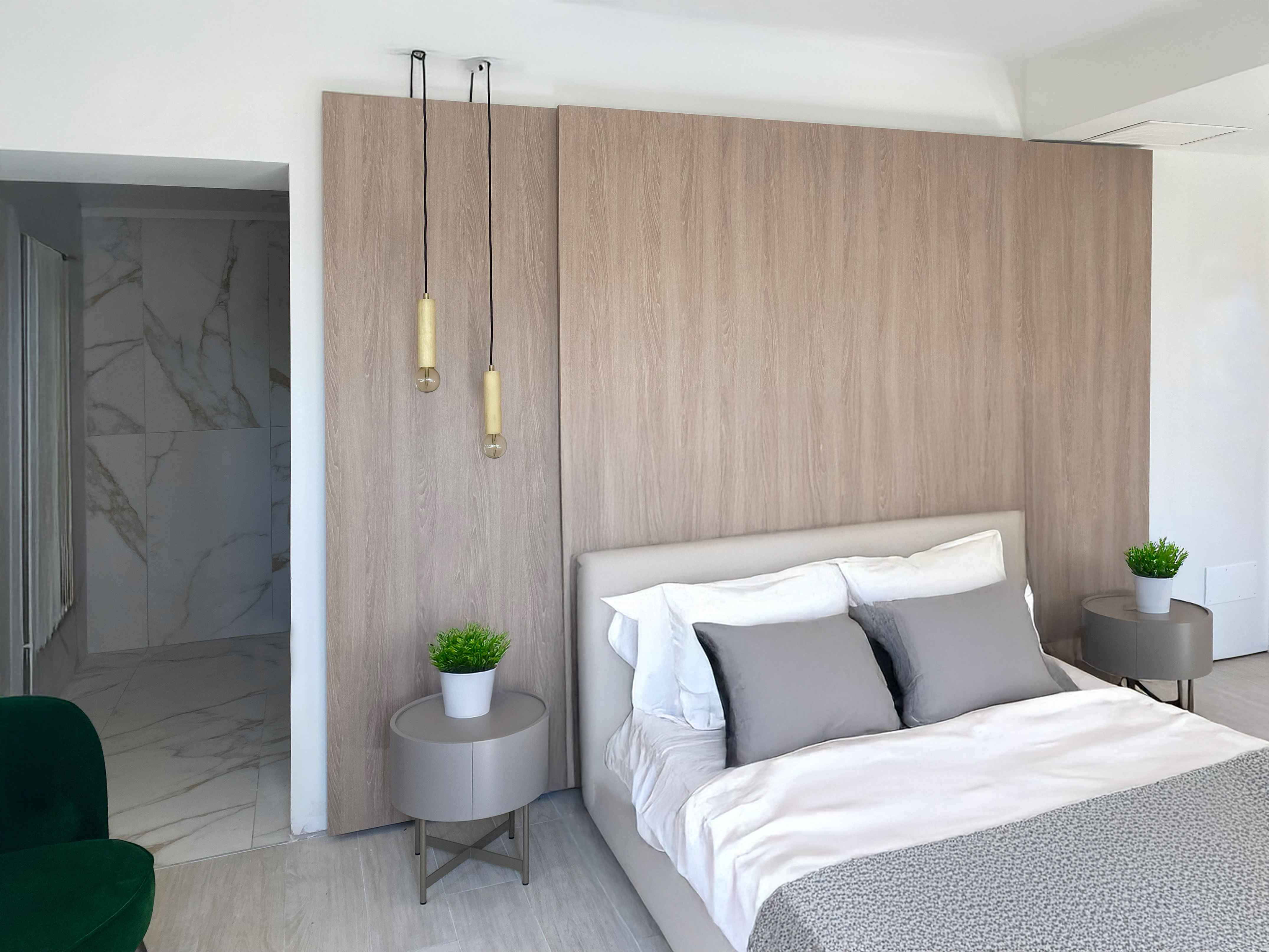 a bedroom with a bed and a plant
