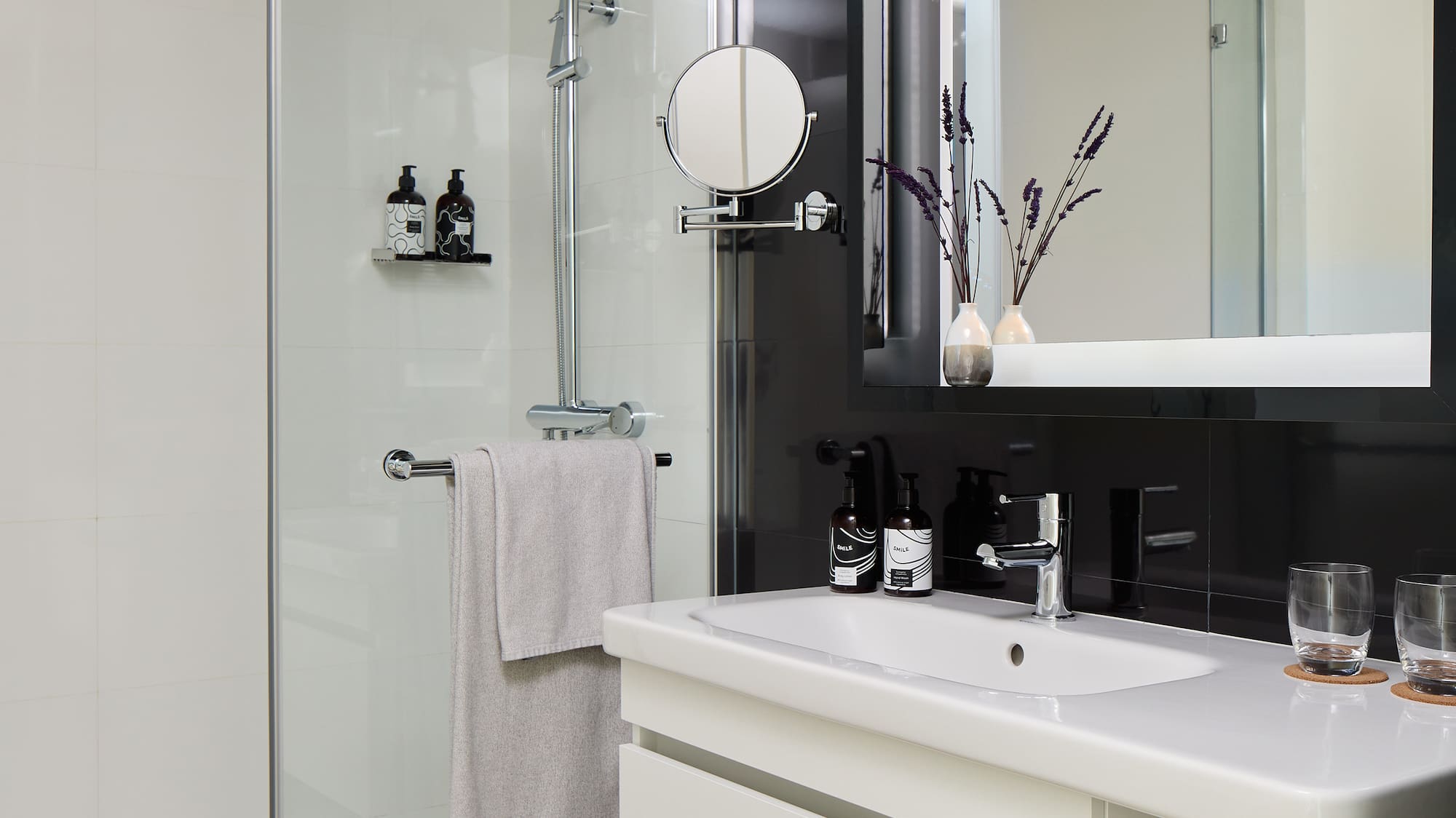 a bathroom with a shower and sink