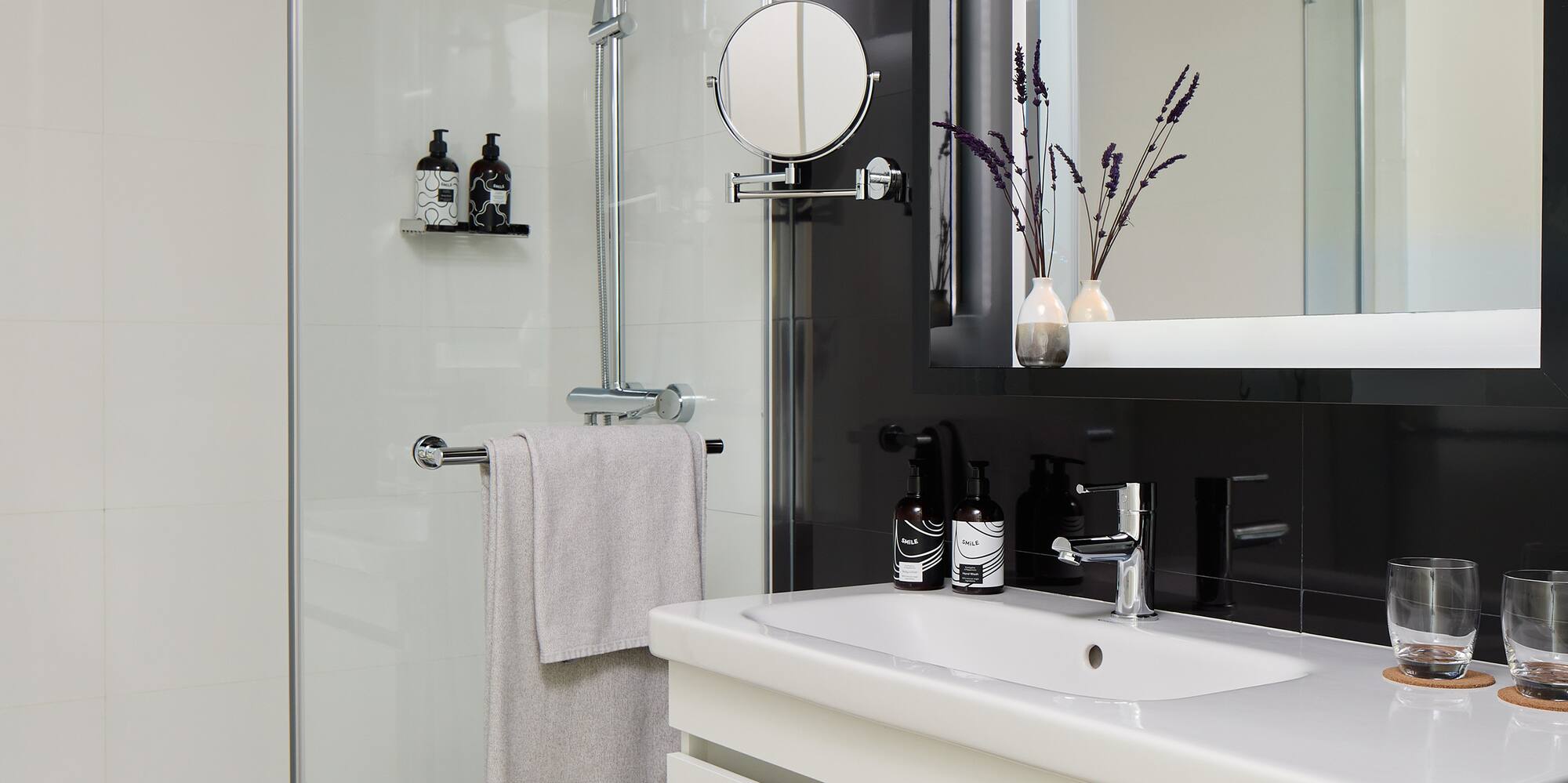 a bathroom with a shower and sink