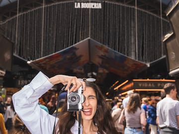a woman taking a picture with a camera