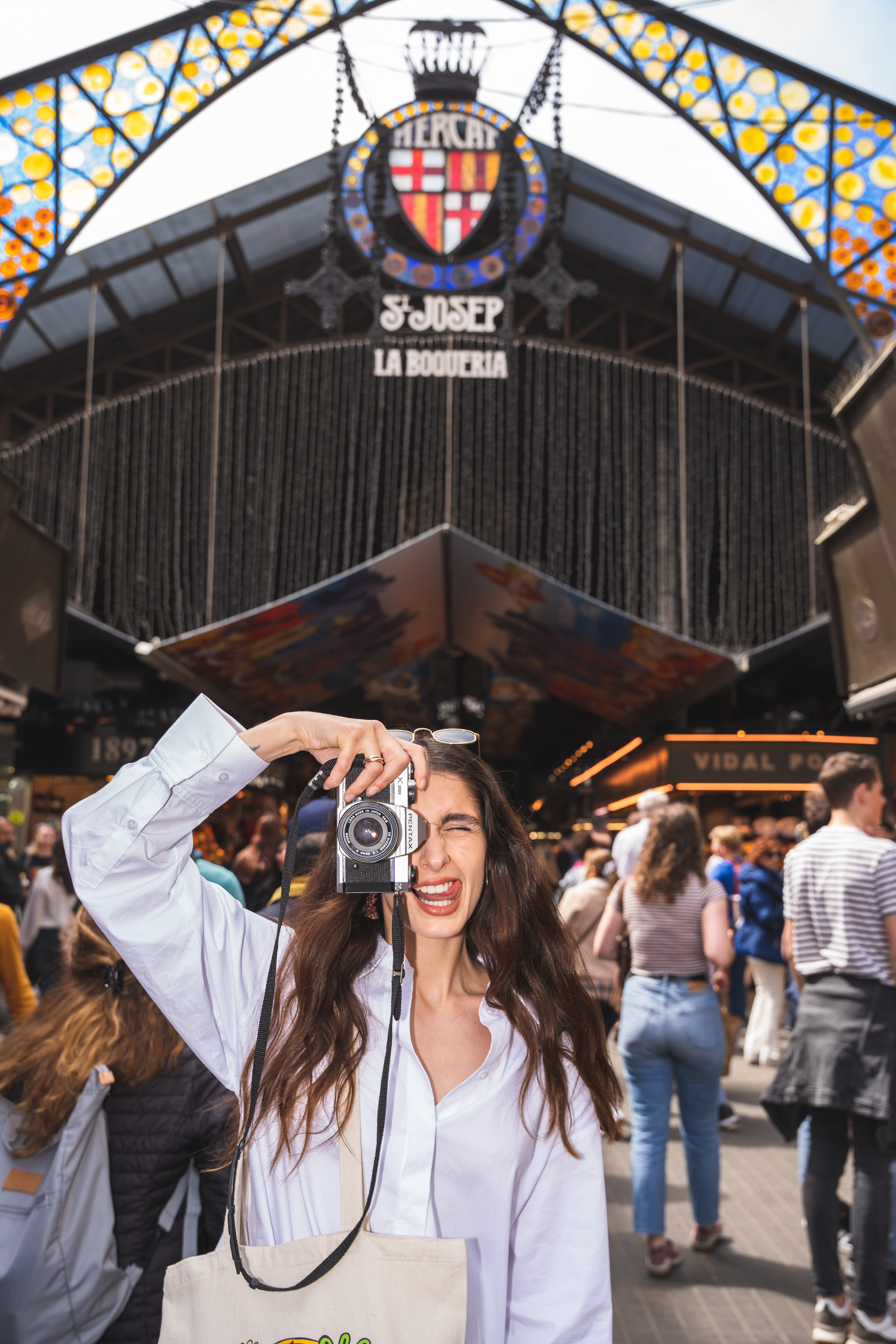 a woman taking a picture with a camera