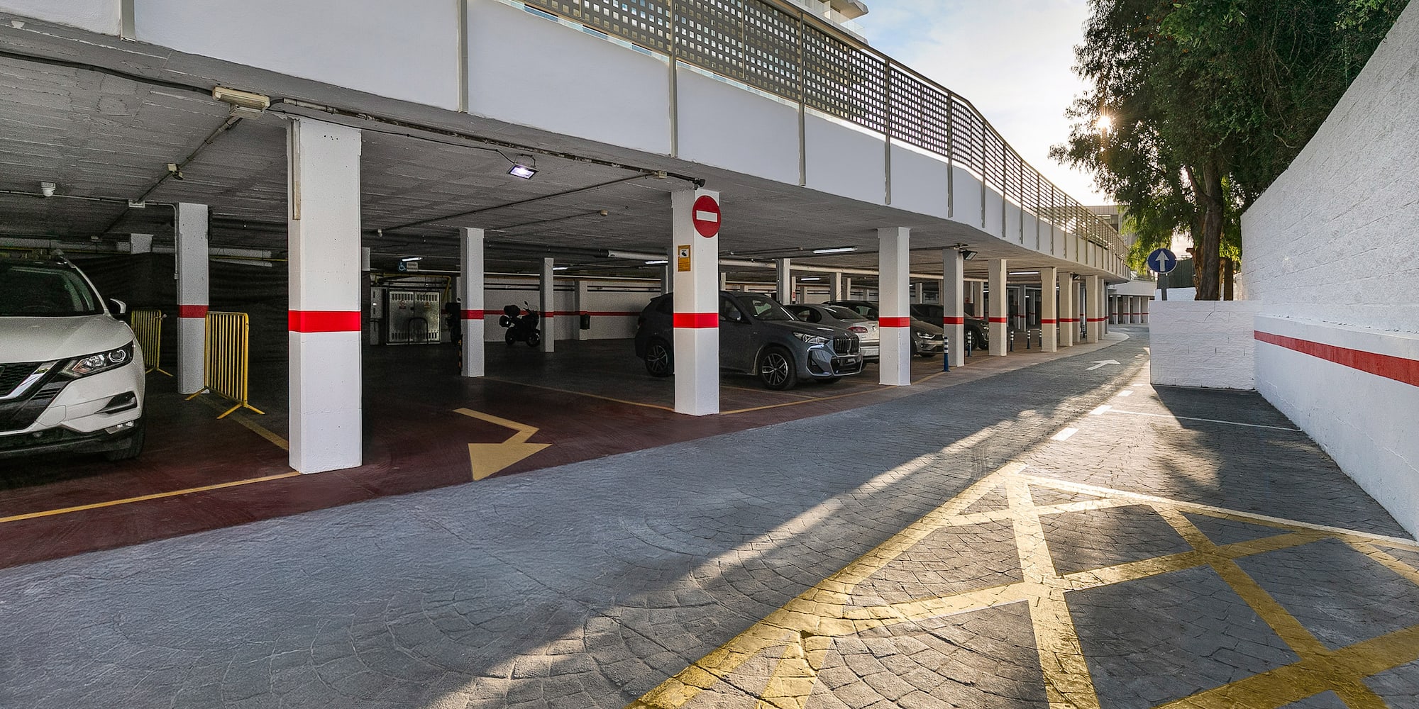 a parking garage with cars parked in it