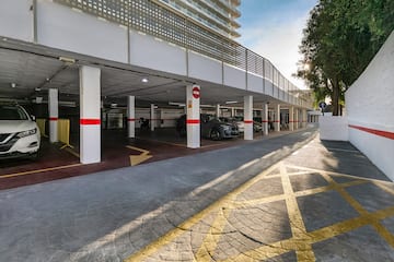 a parking garage with cars parked in it