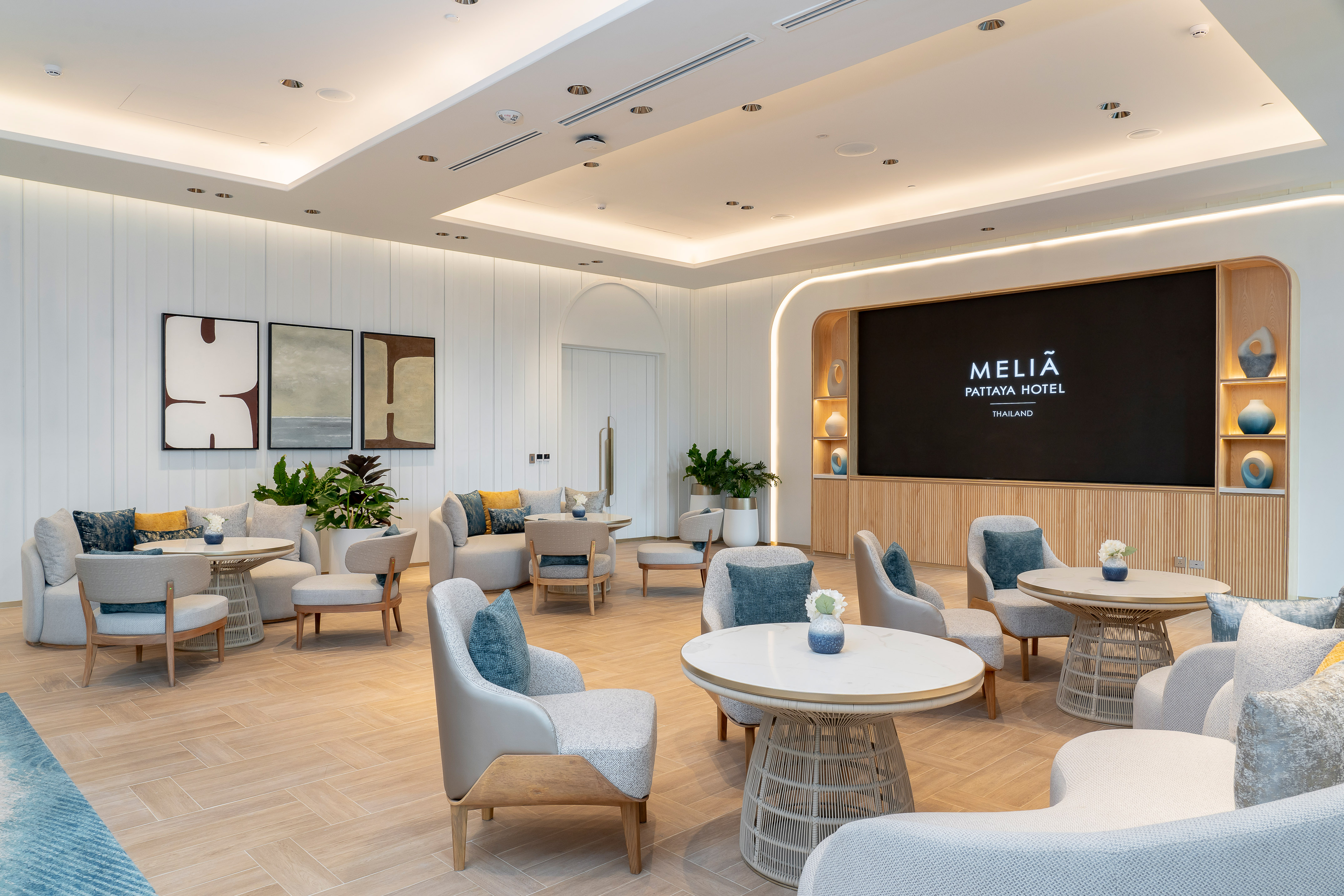 Modern Meliá Pattaya Hotel lounge with stylish seating and brand screen.