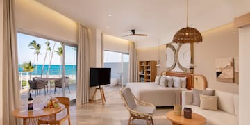 a room with a bed and a television