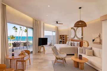 a room with a bed and a television