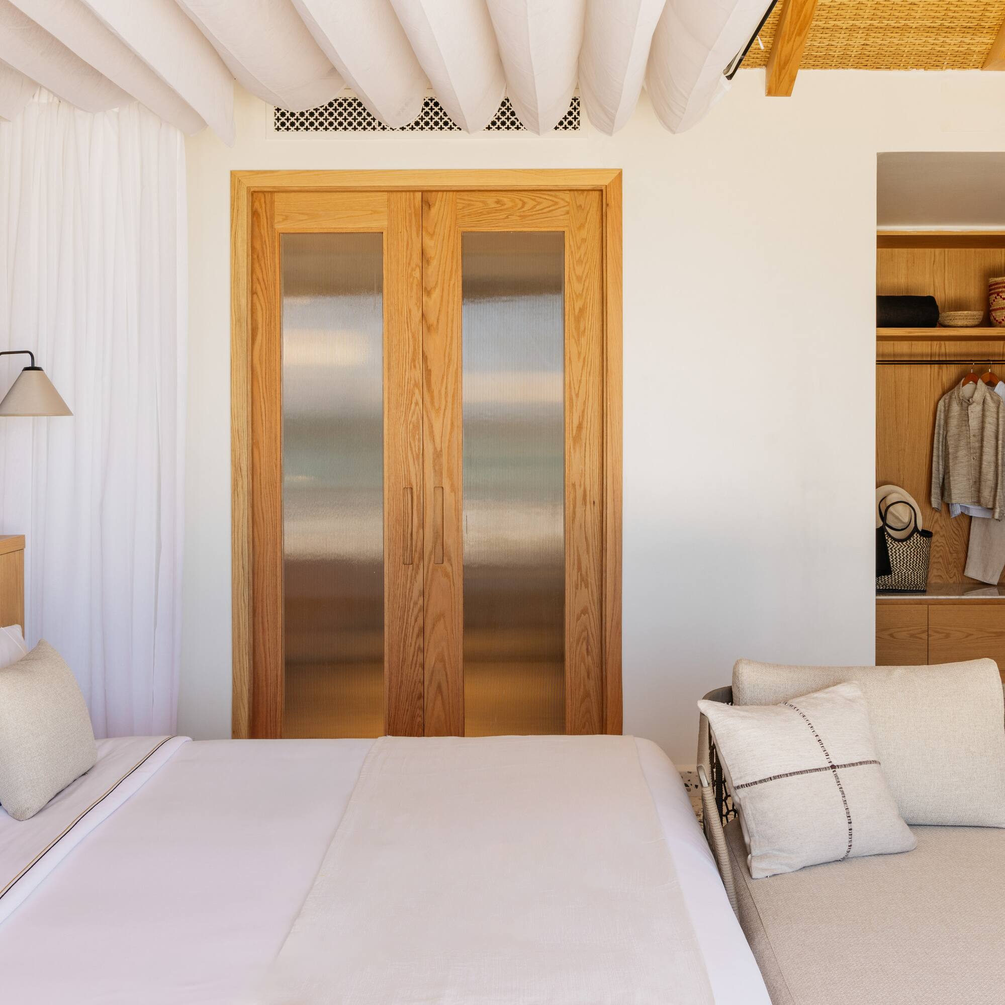 a bedroom with a bed and a closet