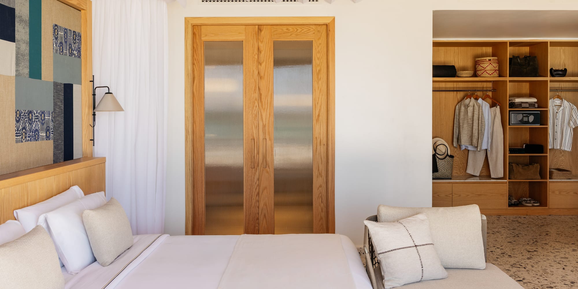 a bedroom with a bed and a closet