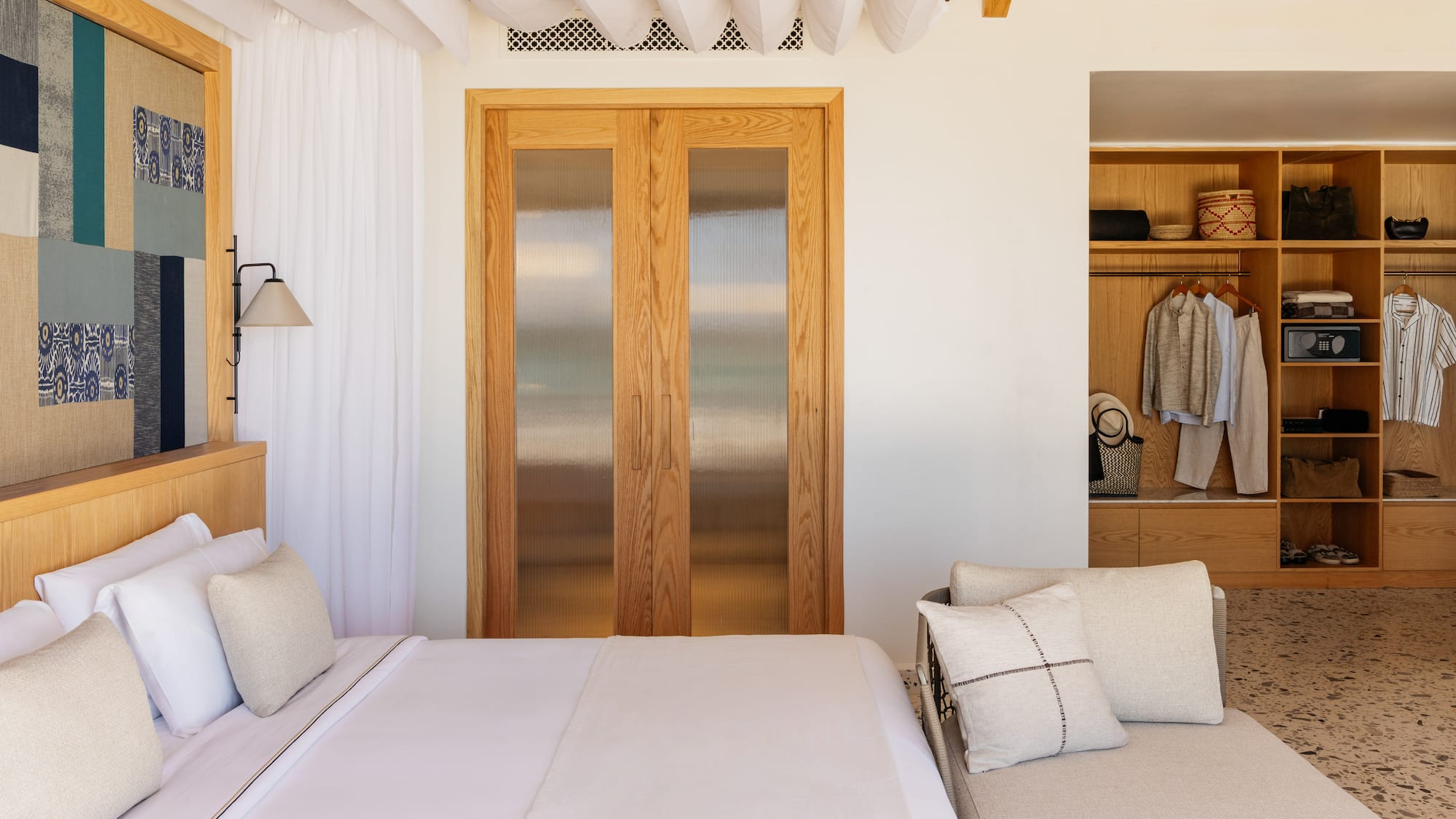 a bedroom with a bed and a closet