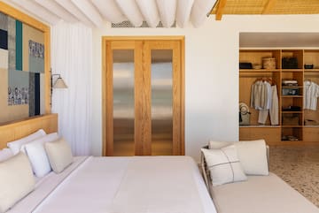 a bedroom with a bed and a closet