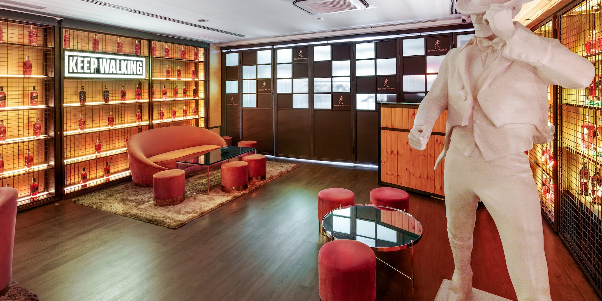 a room with a statue and a table and chairs