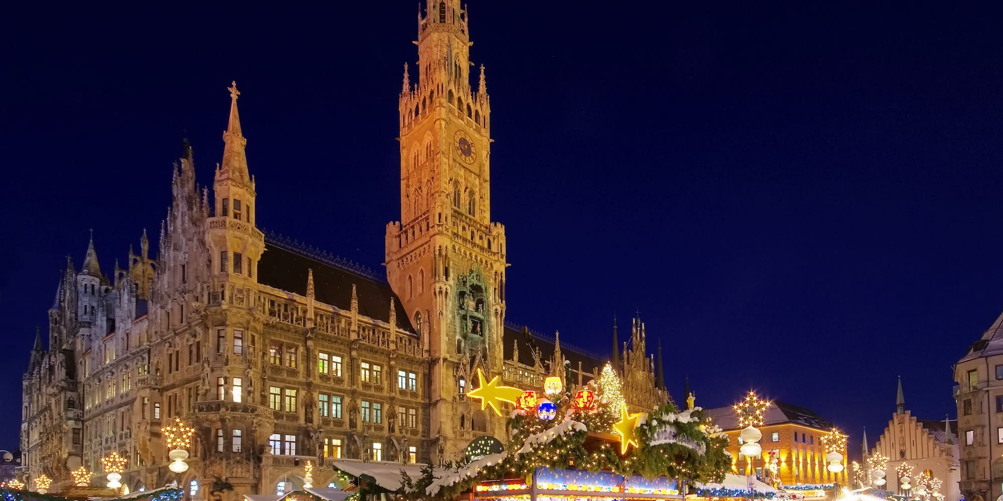 Munich Christkindlmarkt at night with illuminated New Town Hall, Germany.