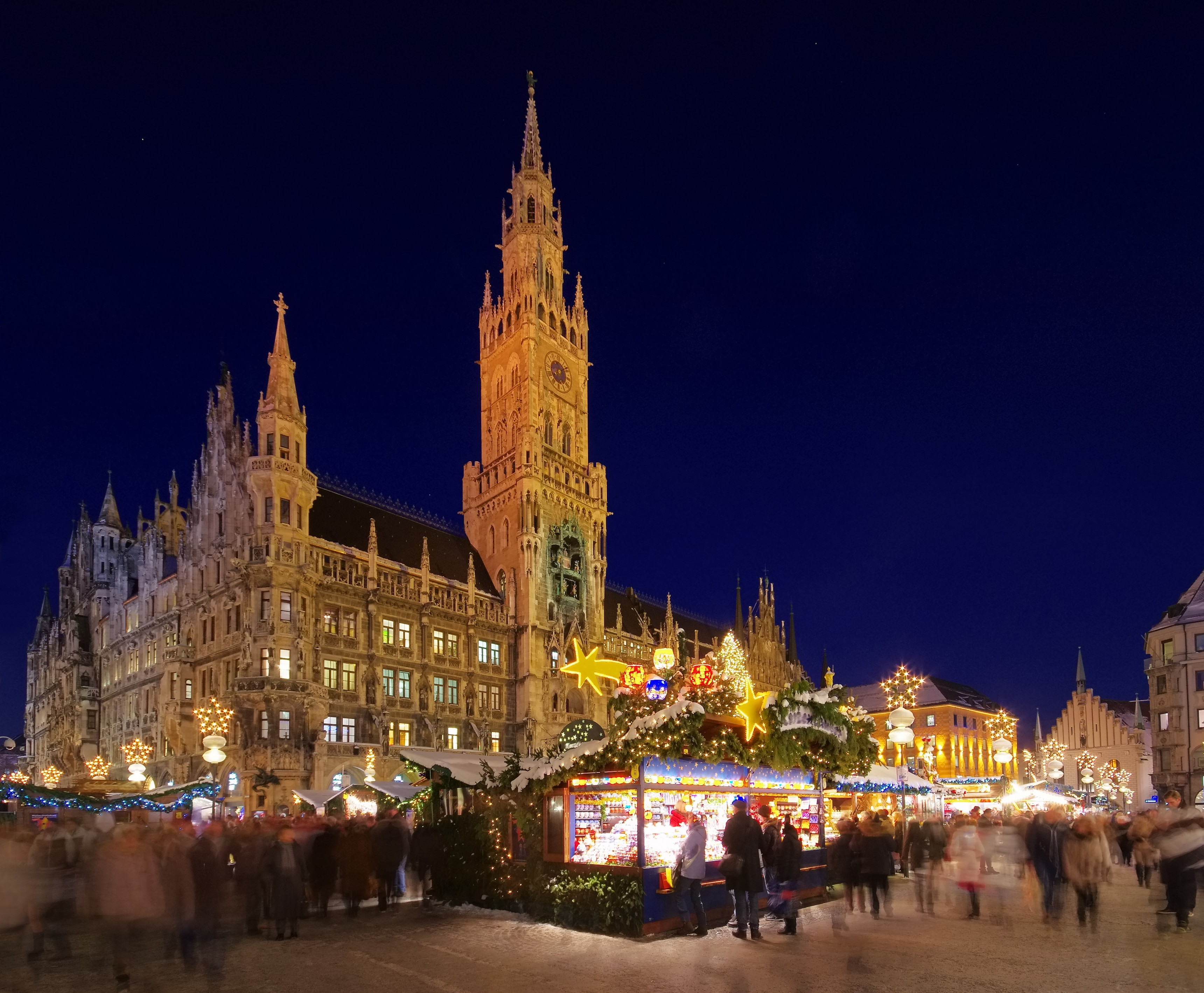 Munich Christkindlmarkt at night with illuminated New Town Hall, Germany.